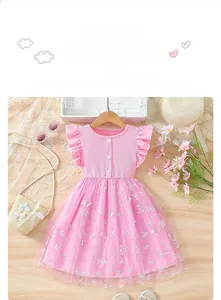 Detail of pink knit bodice with ruffle sleeves and butterfly print mesh skirt