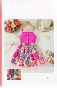 Detailed flat lay of a girls pink ribbed camisole and floral mesh skirt with summer props