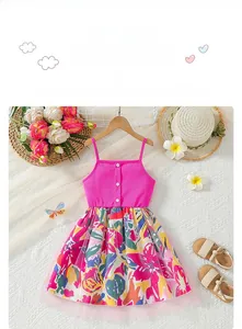 Detail of pink knitted bodice and floral tulle skirt of a summer girls' dress