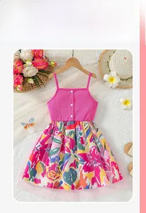 Detail of pink ribbed bodice with white buttons and colorful floral printed mesh skirt