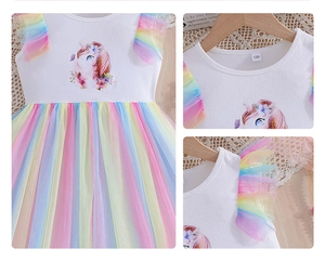 Detail of girls' unicorn rainbow dress featuring ruffled sleeves and soft mesh tulle layers