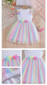 Detail of multi-color rainbow mesh tutu dress for girls with pastel ribbon bow accents