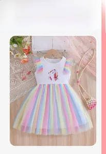 Detail of girls summer dress with unicorn print and colorful rainbow mesh tutu skirt