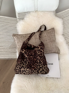 Detailed texture of leopard print corduroy tote bag featuring large capacity storage
