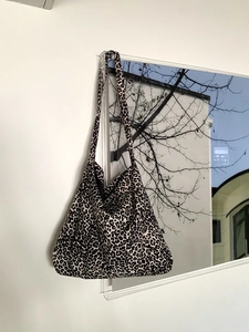 Detailed close-up of corduroy leopard print tote bag with soft texture and vintage style