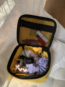 Large capacity yellow nylon travel toiletry bag with interior mesh pocket for storage