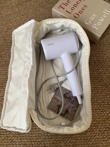 Portable large storage bag for hair dryer and styler with zipper closure in cream white