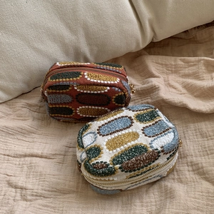 Mini embroidered coin purse set with colorful geometric patterns and gold zipper closure