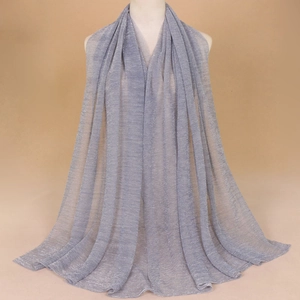 Elegant silver grey shawl with metallic thread and pleated texture on a mannequin