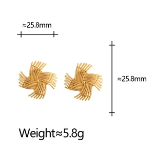 Golden sunburst stud earrings with radial woven texture and minimalist gear design
