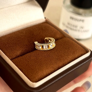 Elegant gold-plated ear cuff with micro-paved zircons and delicate beaded edge detail