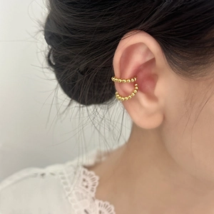 Minimalist gold beaded ear cuffs for women shown on model for daily commuting style