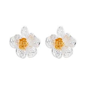 Elegant white floral stud earrings with textured silver petals and golden center details