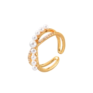 Elegant gold open ring with graduated white pearls and shimmering cubic zirconia stones