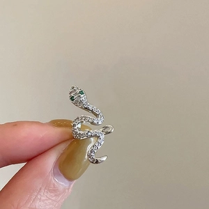Silver snake ear cuff with sparkling zircon inlay and green gemstone eyes for women