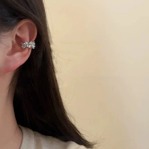 Elegant pearl and zircon ear cuff earring displayed on model in silver white finish