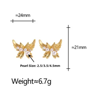 Detail of golden butterfly earrings with textured metal wings and bright white pearls