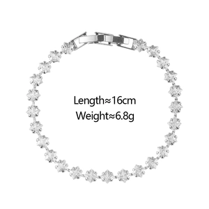 Detailed close-up of a silver tennis bracelet with square-cut cubic zirconia and folding clasp