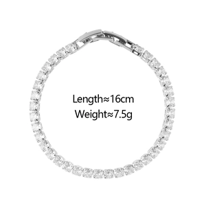 Detailed view of silver tennis bracelet with cubic zirconia and fold-over safety clasp