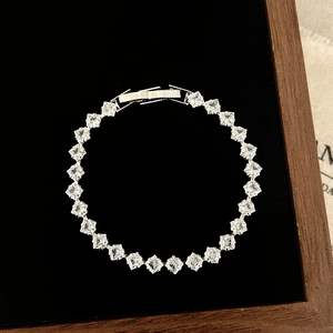 Elegant silver bracelet featuring square-cut sparkling zircons on a black velvet base