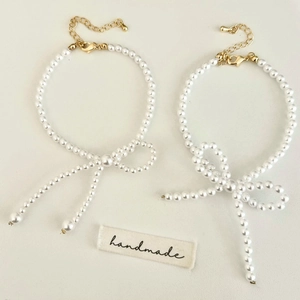 Bracelet Künstliche Perles Élégant Nœud Papillon Fausses Künstliche Perles Alliage Plaqué Or Bijoux Doux Et Polyvalents Pour Femmes