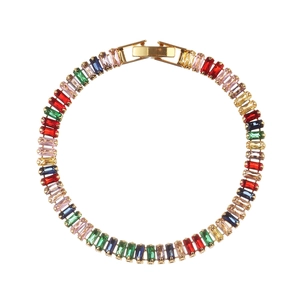 Detailed view of gold bracelet with multi-colored rectangular zirconia crystals