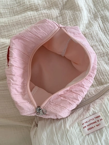 Two-piece pleated nylon makeup bag set in pink and white for travel organization