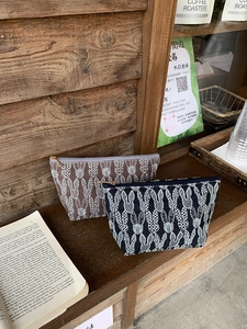 Close-up of embroidered rabbit patterns on cotton linen fabric zipper cosmetic bags