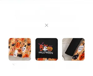 Detail of Halloween kids dress fabric with ghost prints and orange bow stitching