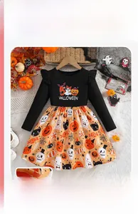 Close-up of Halloween girls' dress with orange mesh tutu and cartoon pumpkin prints