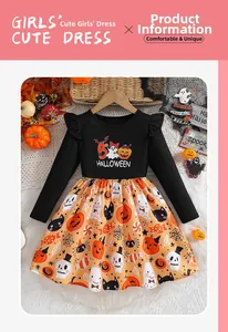 Detail of girls' Halloween dress with ruffles, cartoon pumpkin print and orange skirt