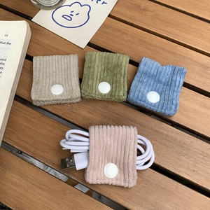 Cord organizer set in corduroy with snap buttons for cable management and storage