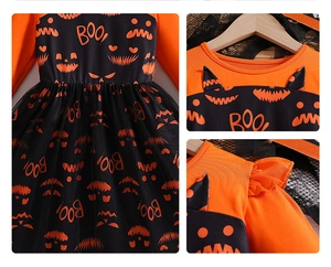 Detail of Halloween baby dress with pumpkin patterns, ruffles, and mesh tutu skirt