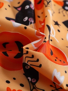 Girl's Halloween dress featuring orange pumpkin, black cat, and spider web prints