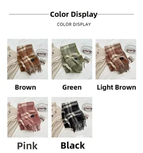 Detail of soft cashmere-feel scarves with tassels and labels in five classic colors