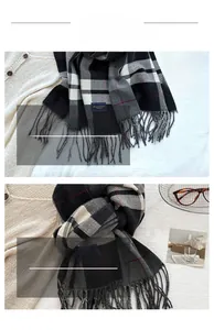 Close-up of vintage plaid scarf with fringed edges and soft cashmere-like knit texture