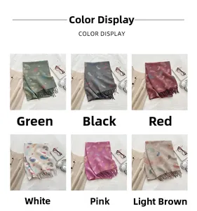 Detail view of paisley pattern knit scarves in six colors including green and beige