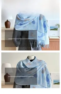 Detail view of light blue striped scarf with cashmere-like texture and tassel fringe edges