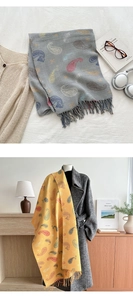Detail of paisley pashmina scarf with vertical knit texture and handmade fringe tassels