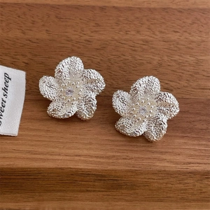 French vintage silver flower stud earrings with textured petals and zircon center