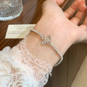 Elegant silver flower bracelet for women featuring micro-pasted zircons and a sparkling center diamond