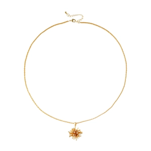 Elegant gold plated fireworks necklace with sparkling zircon pendant on white background