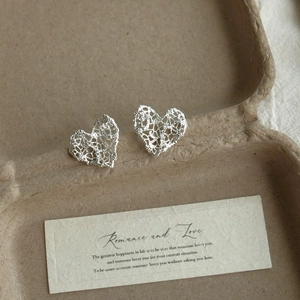Elegant hollow lace heart stud earrings in silver metal for women minimalist fashion