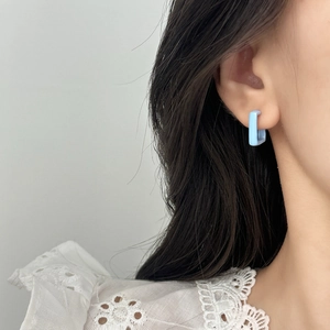 Minimalist light blue square geometric stud earrings for women shown on model