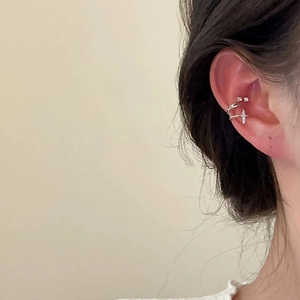 Minimalist silver double-layer ear cuff with cross charm and zircon stones on model