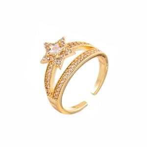 Elegante anello a stella dorato con zirconi brillanti e fascia regolabile per donna