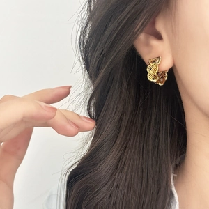 Elegant gold multi-layer spiral woven hoop earrings for a stylish textured metal look