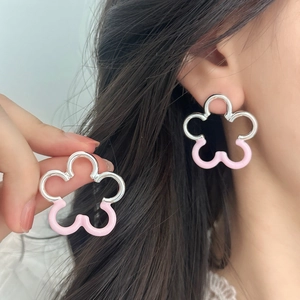 Elegant hollow floral stud earrings with pink enamel finish for a sweet summer look