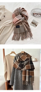 Detail of winter thick plaid scarf featuring soft fringe and Elegance Classic woven label