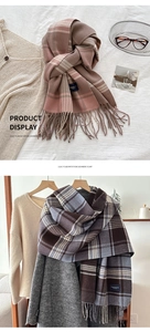 Detail showing soft imitation cashmere fabric texture and fringe on plaid scarf